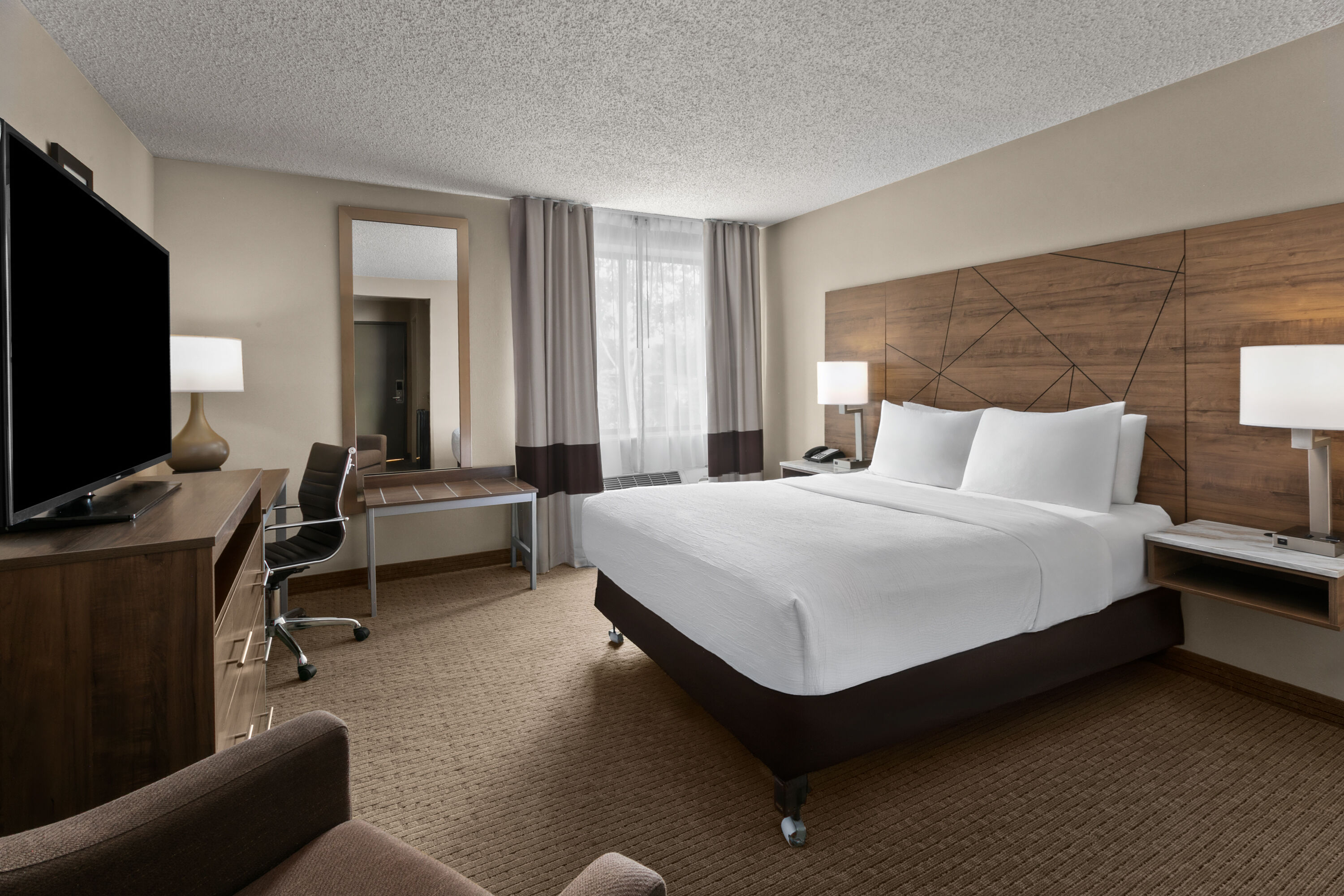 Guest room at the Wingate by Wyndham Utica in Utica, Michigan