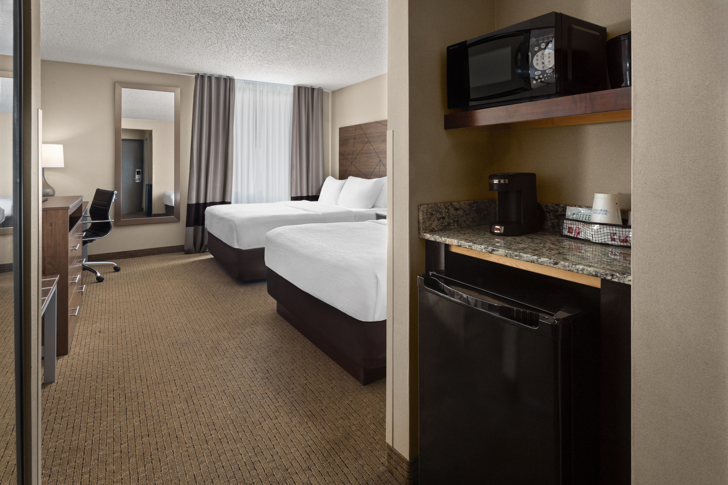 Guest room at the Wingate by Wyndham Utica in Utica, Michigan