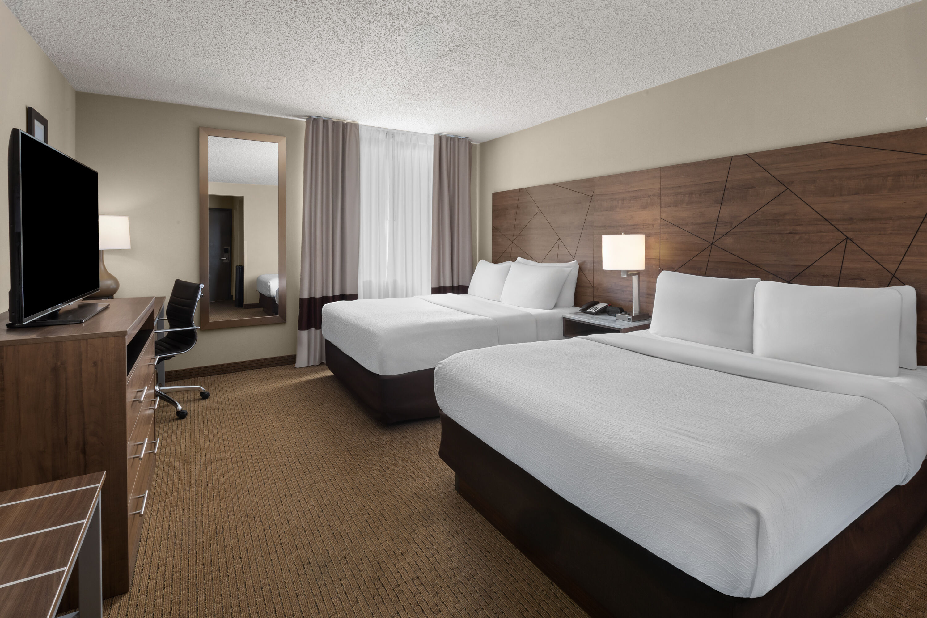 Guest room at the Wingate by Wyndham Utica in Utica, Michigan