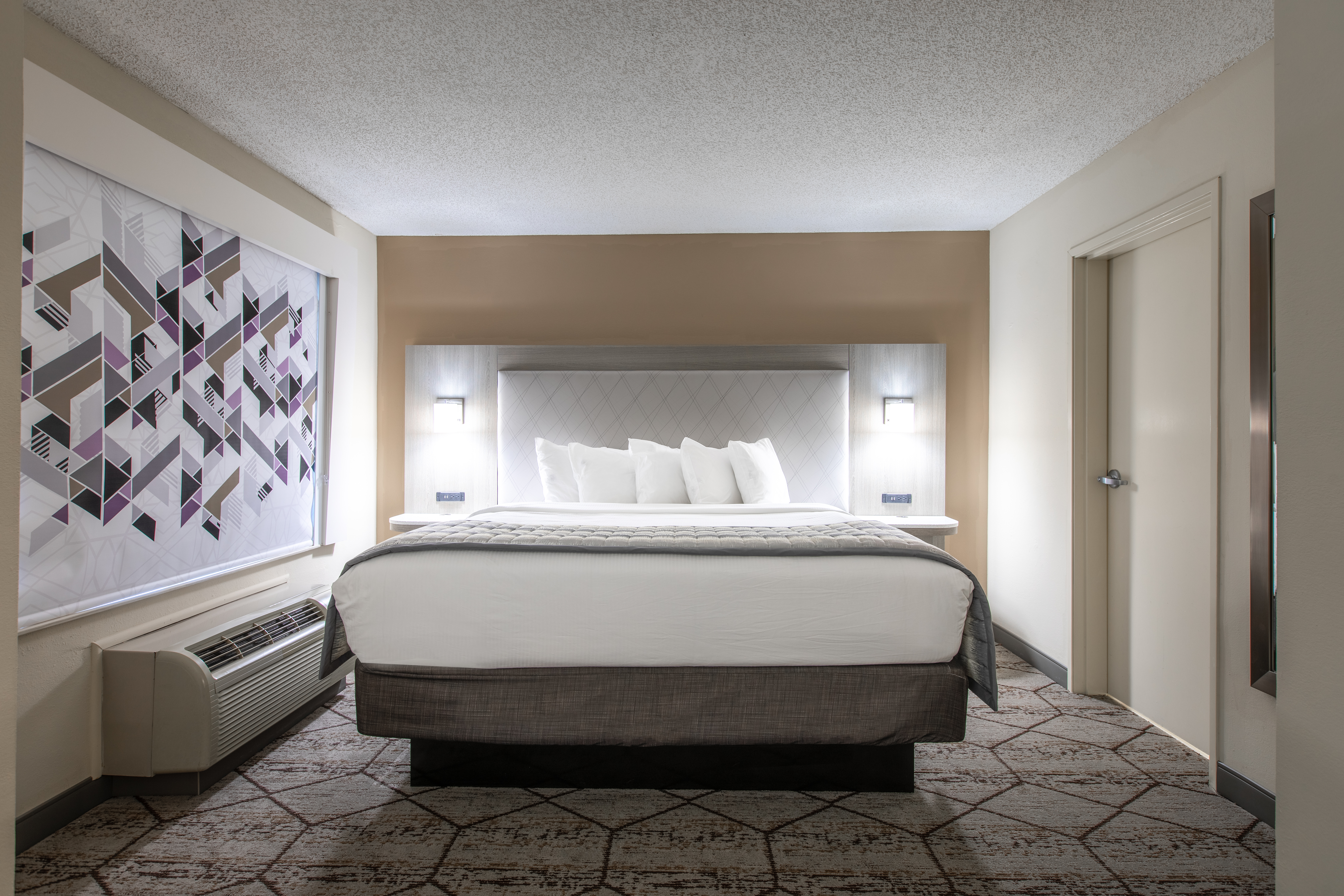 Guest room at the Wingate by Wyndham Charlotte Speedway/Concord in Concord, North Carolina