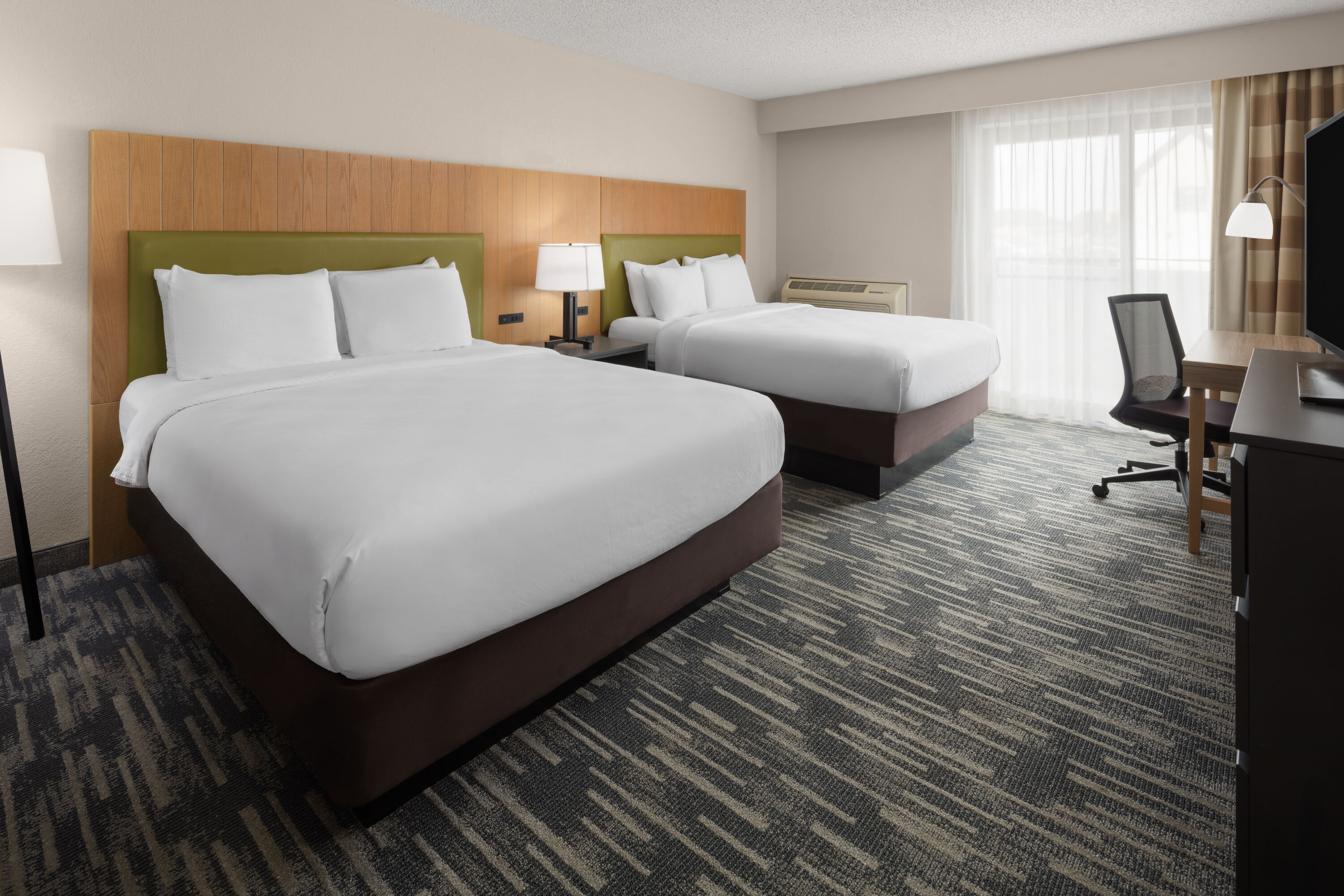 Guest room at the Wingate by Wyndham Lincoln Airport East I-80 in Lincoln, Nebraska