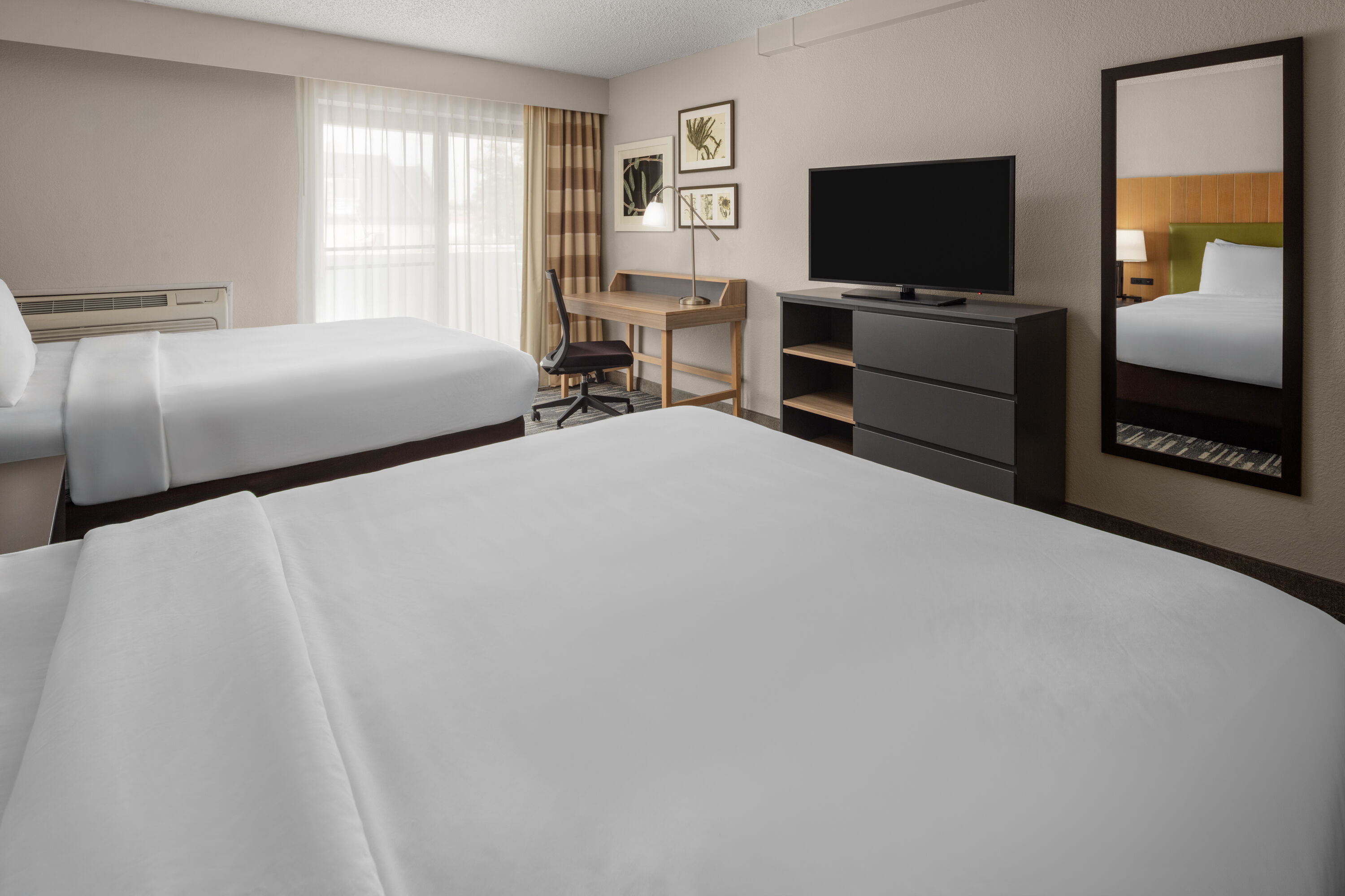 Guest room at the Wingate by Wyndham Lincoln Airport East I-80 in Lincoln, Nebraska