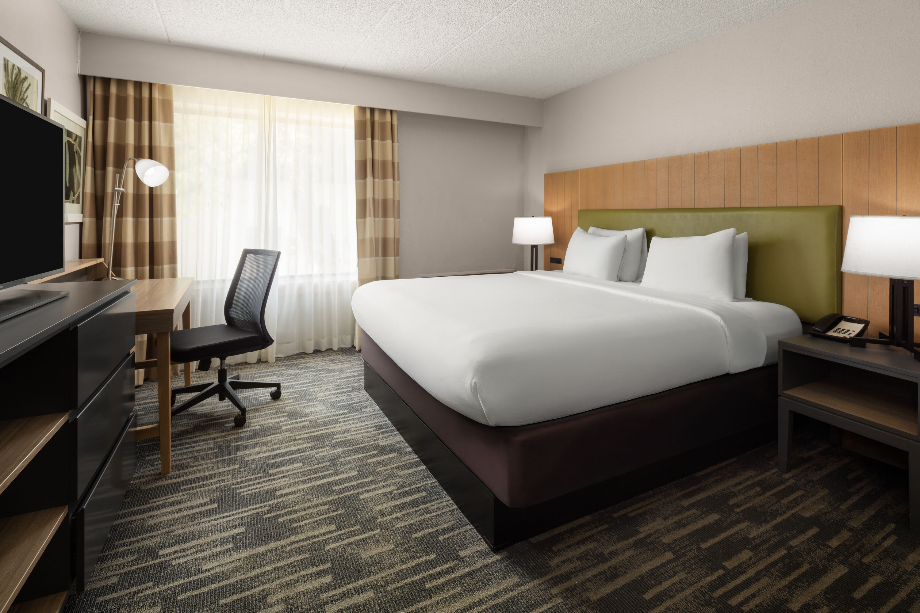 Guest room at the Wingate by Wyndham Lincoln Airport East I-80 in Lincoln, Nebraska