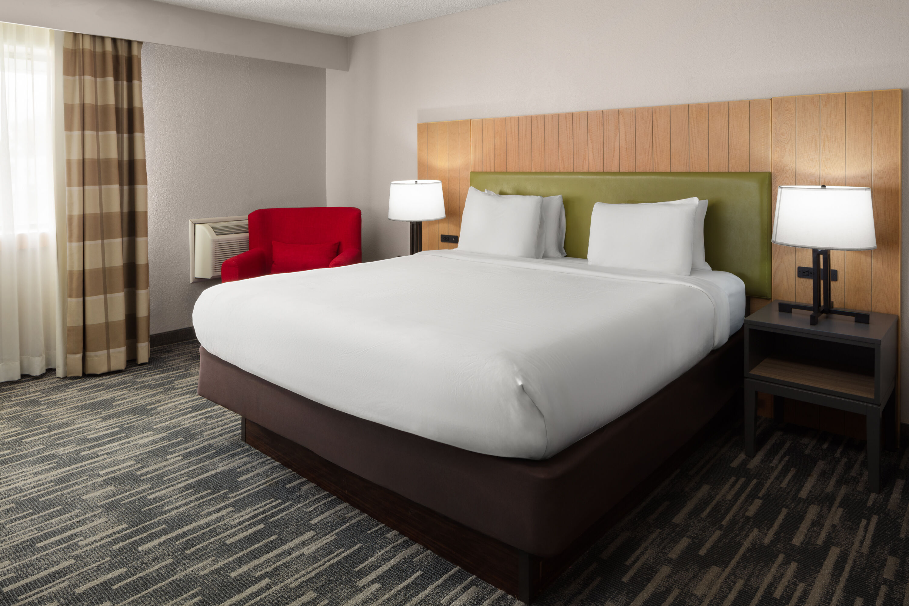 Guest room at the Wingate by Wyndham Lincoln Airport East I-80 in Lincoln, Nebraska