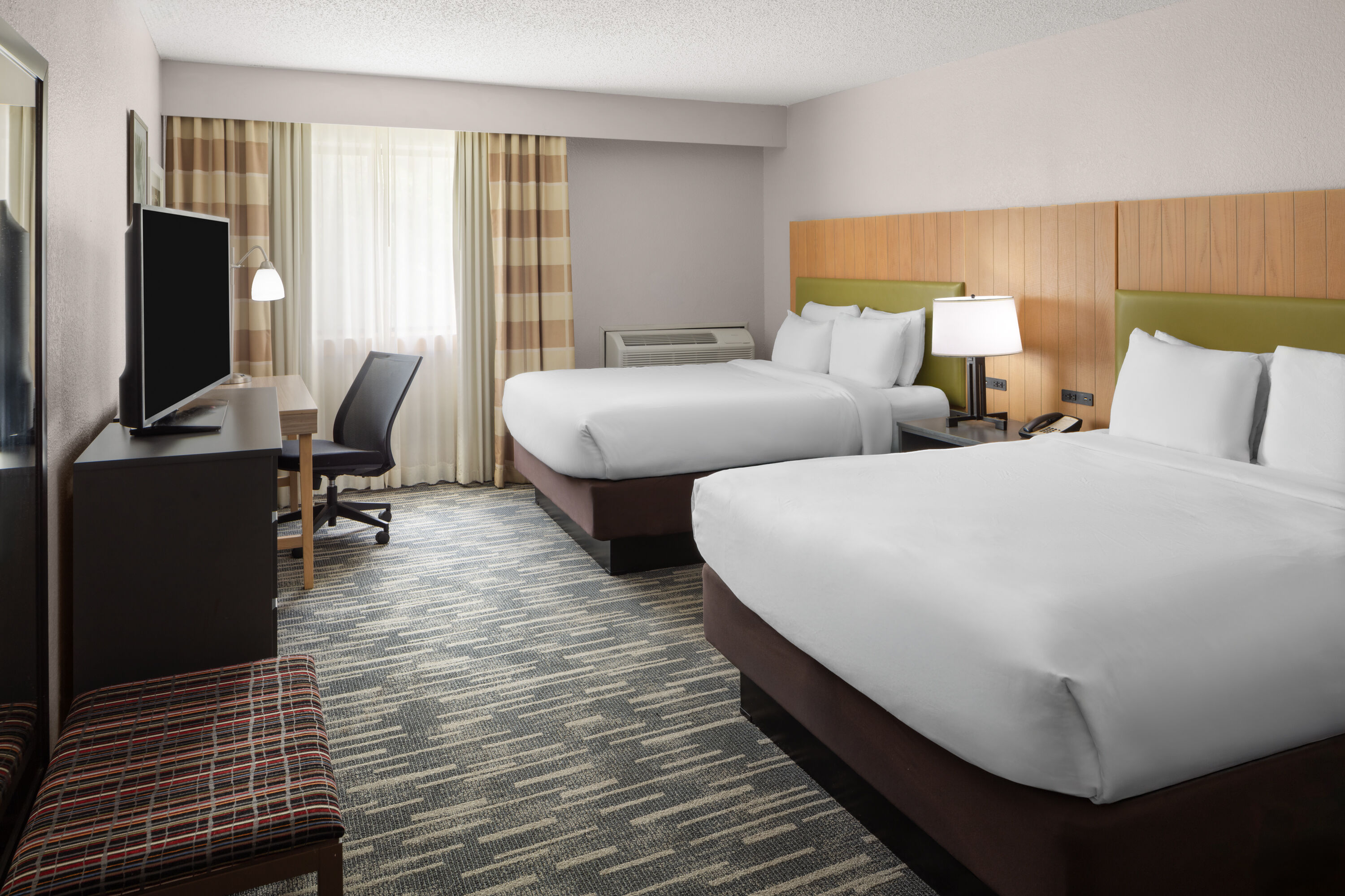 Guest room at the Wingate by Wyndham Lincoln Airport East I-80 in Lincoln, Nebraska