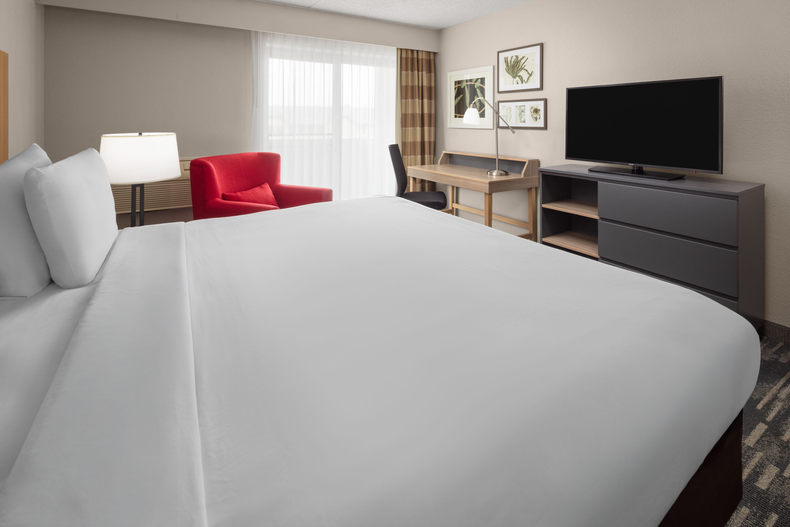 Guest room at the Wingate by Wyndham Lincoln Airport East I-80 in Lincoln, Nebraska