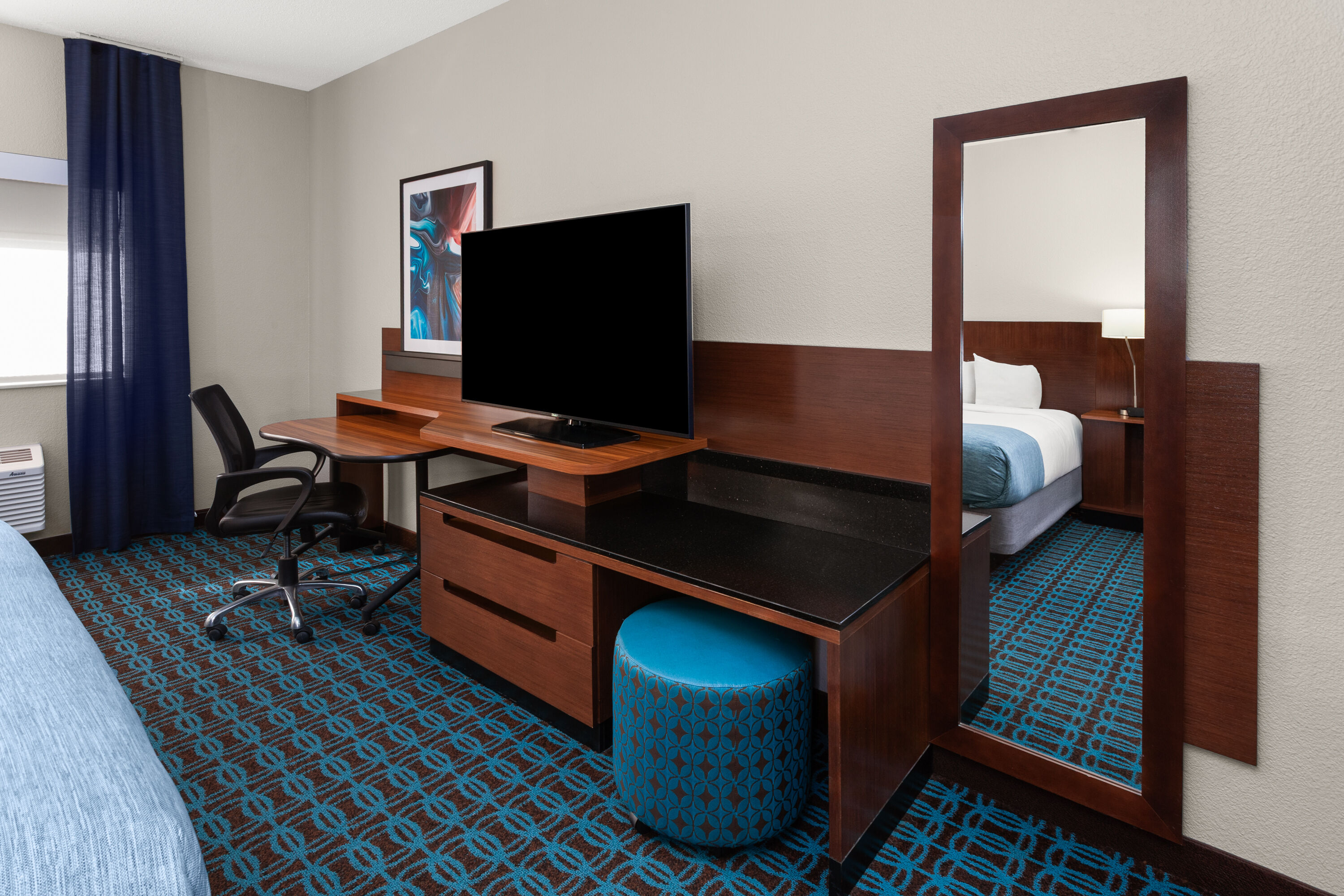 Guest room feature at the Wingate by Wyndham Oshkosh in Oshkosh, Wisconsin