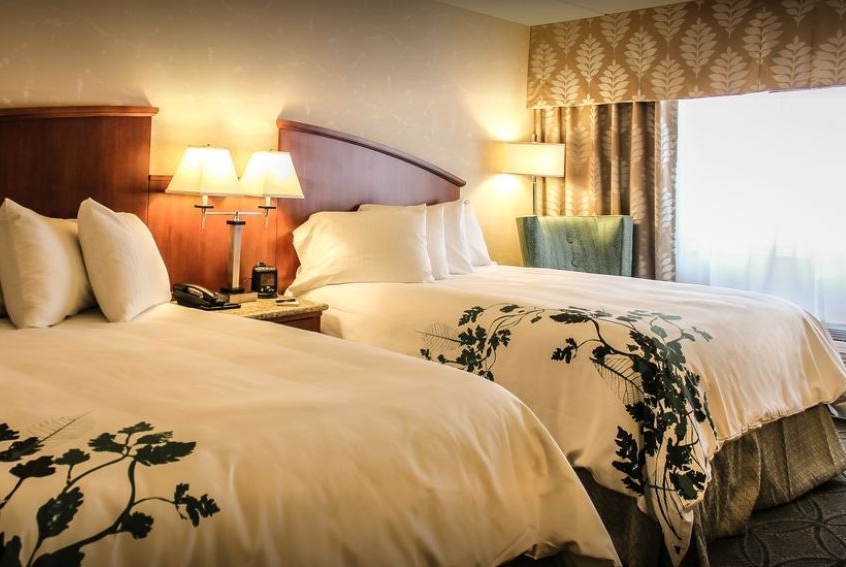 Queen bed guest room at the Wingate by Wyndham Elkins in Elkins, West Virginia