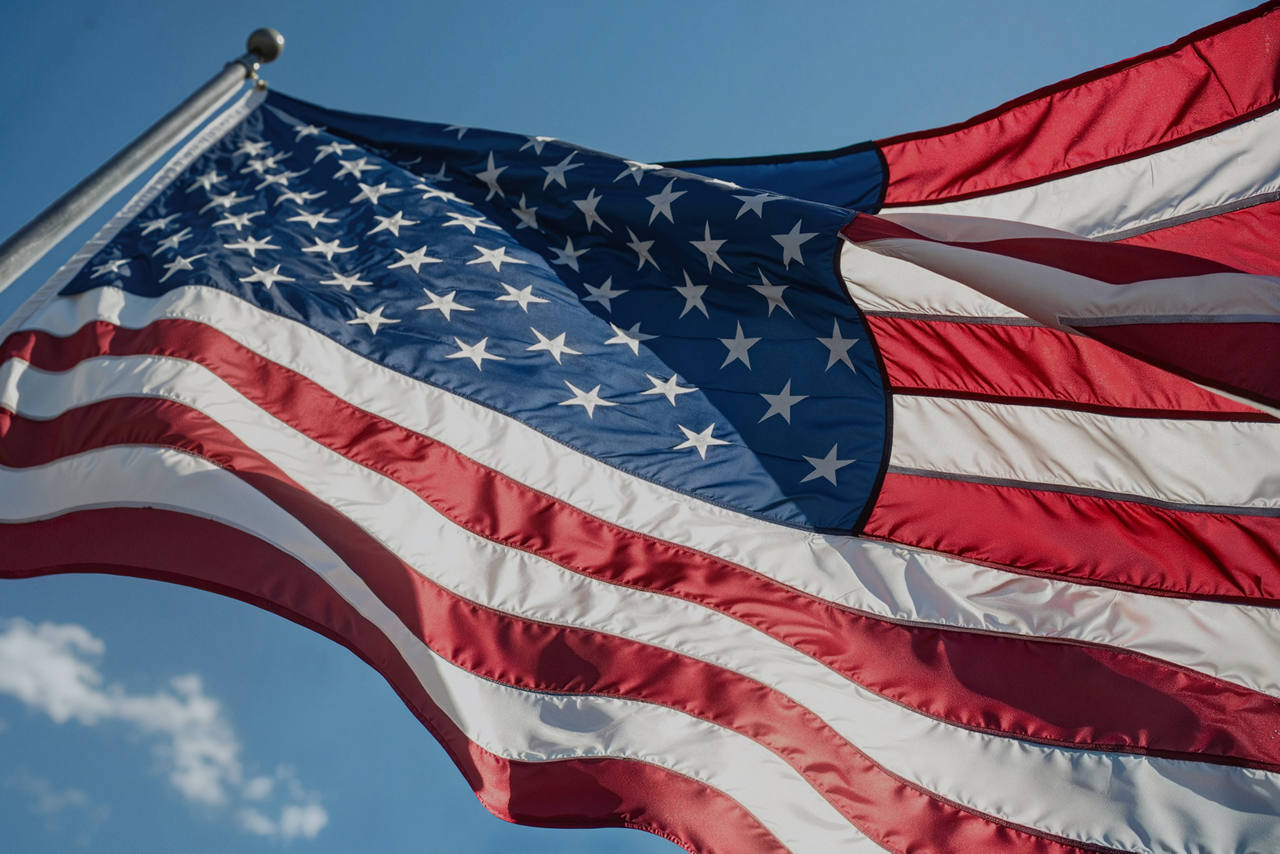 Flag of the United States of America on flag pole